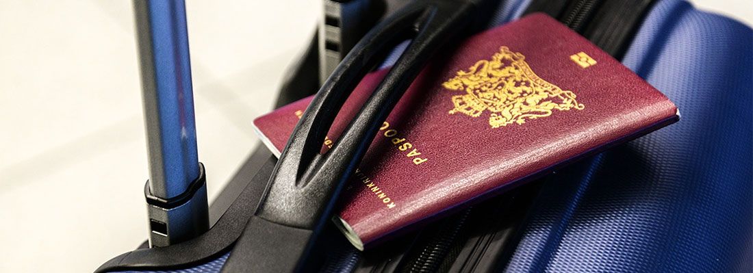 A passport on top of a suitcase
